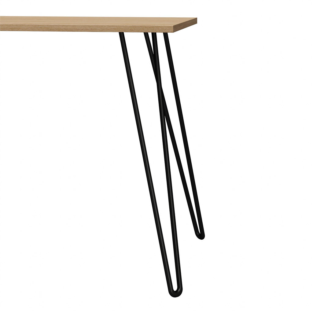 Table with a wooden top and black hairpin legs on a white background