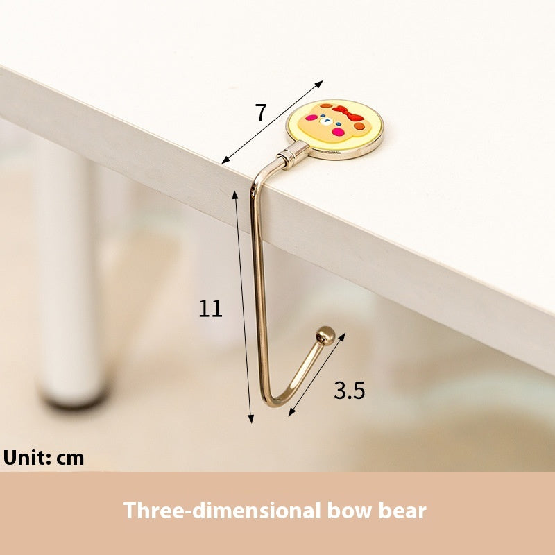 Measurement diagram of a decorative hook with a three-dimensional bear design on a white background.