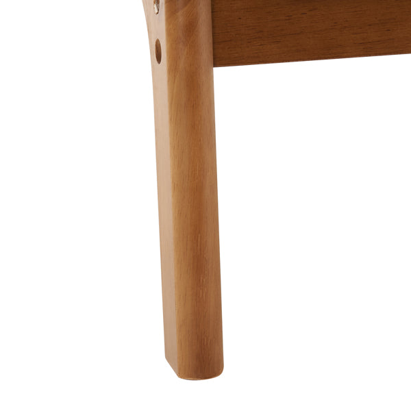 Close-up of a wooden chair leg on a white background