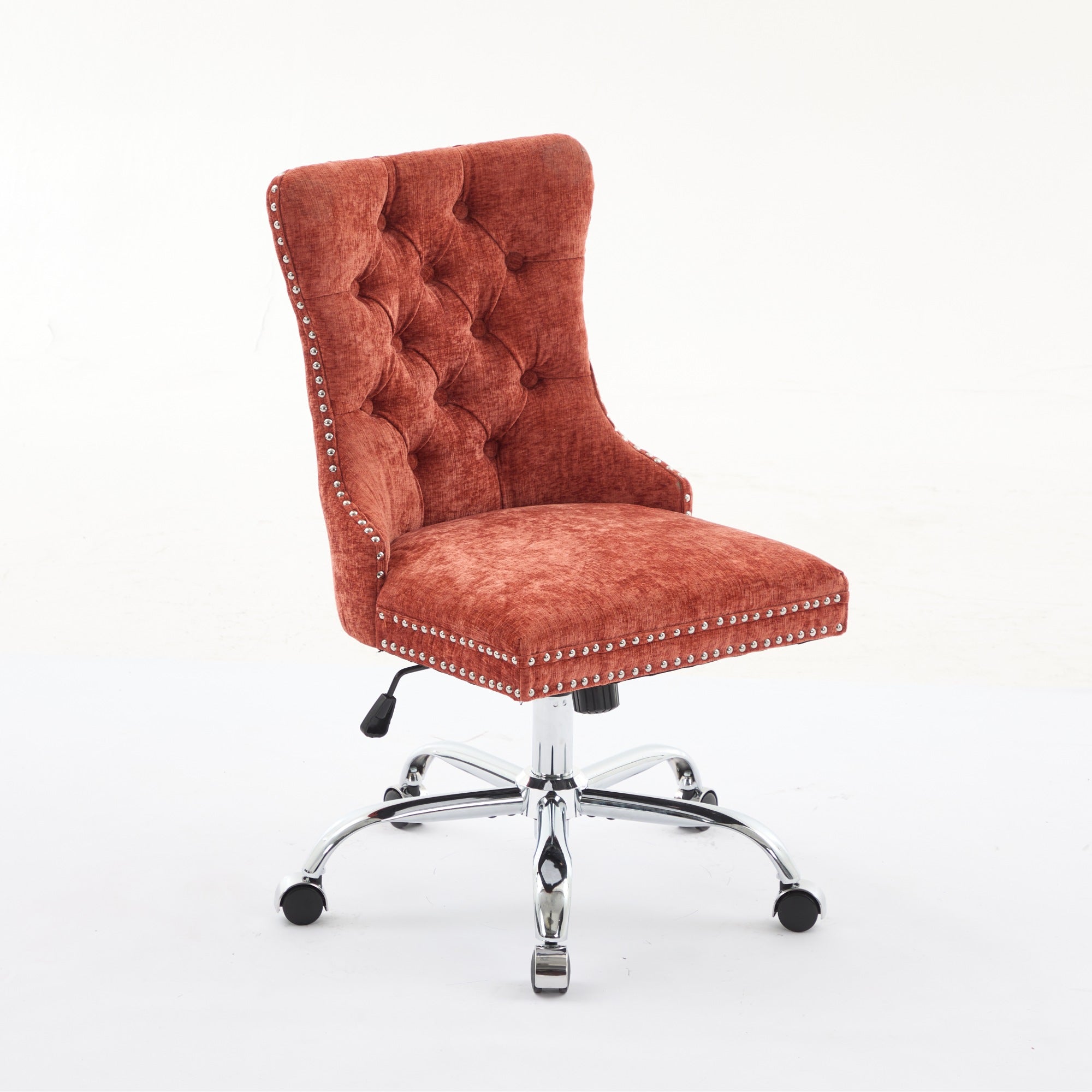 Orange office chair with tufted backrest in a home office setting