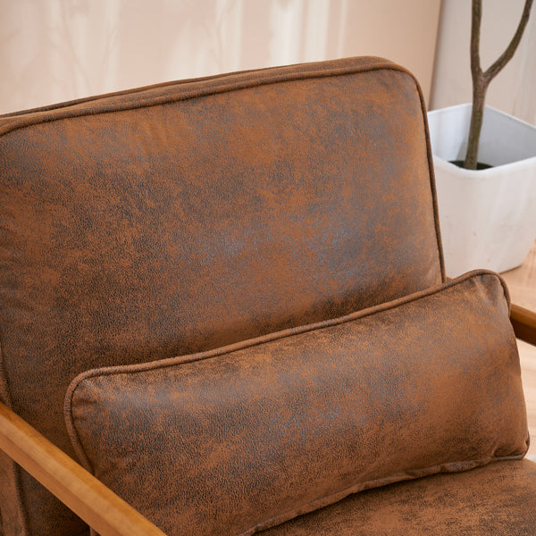 Brown leather sofa with a matching pillow in a neutral setting