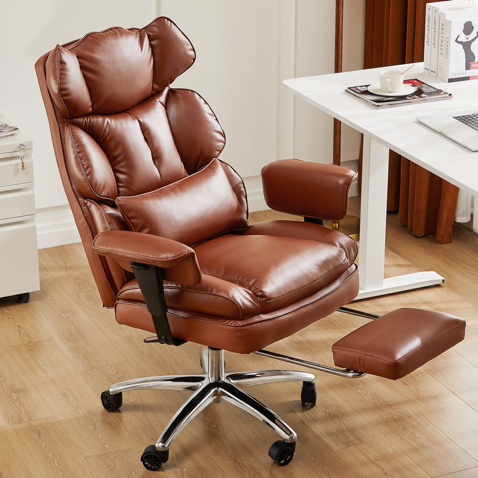 Brown leather office chair with ottoman in a home office setting.