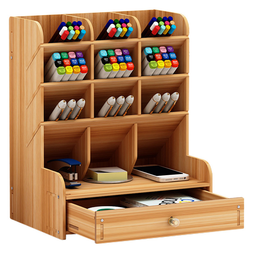 Wooden desk organizer with shelves and a drawer containing stationery items on a white background