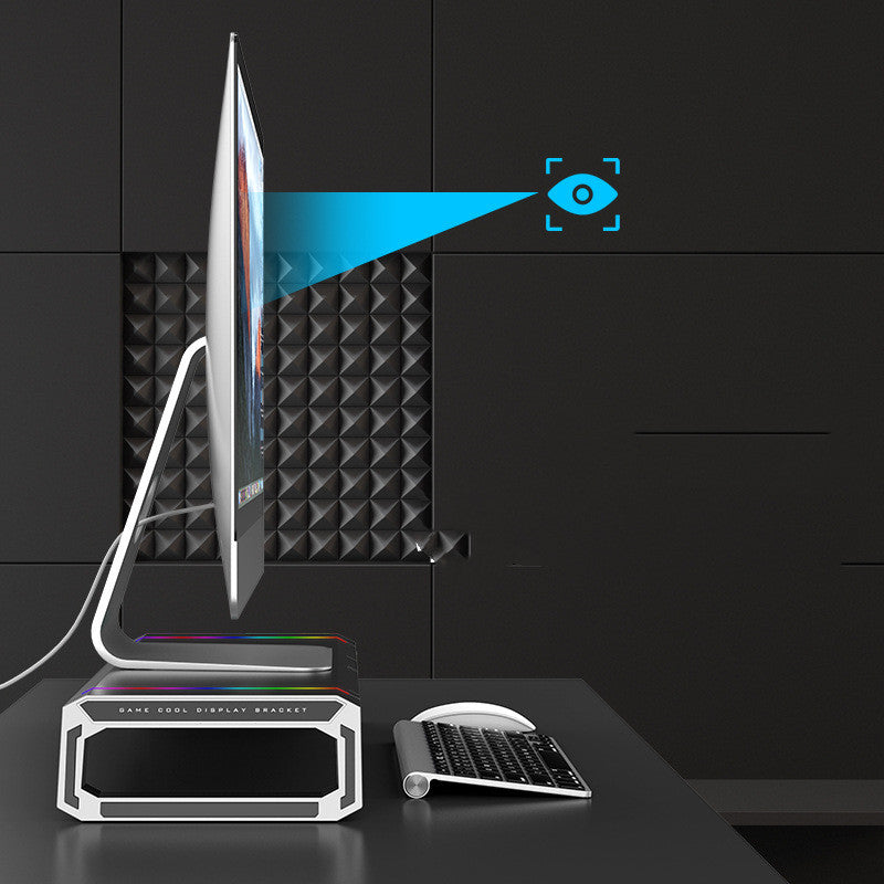 Modern computer setup with a sleek monitor and keyboard on a dark surface.