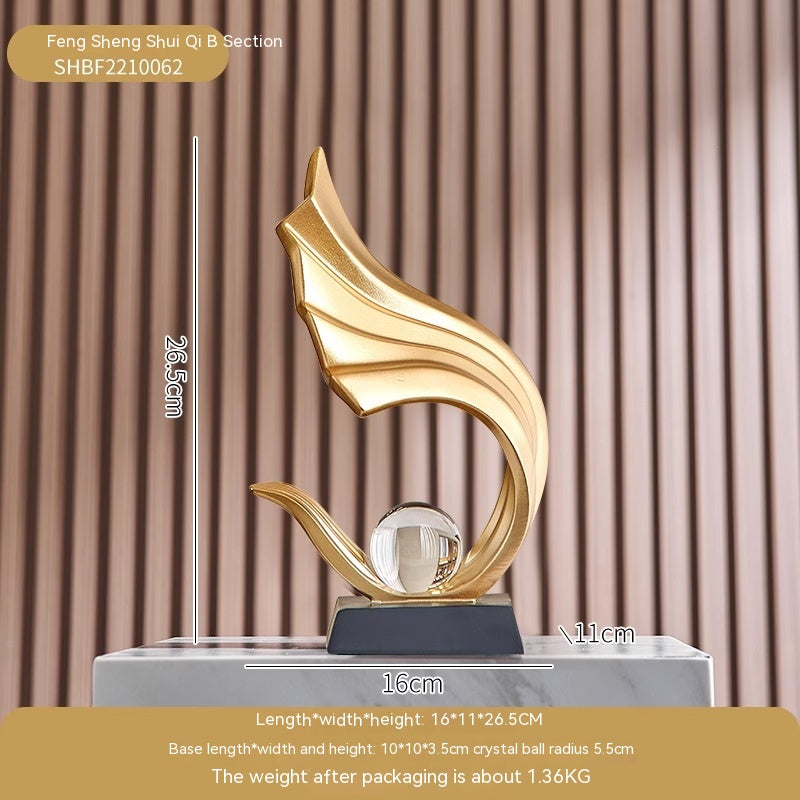 Gold decorative sculpture on a marble base with dimensions and product code displayed.