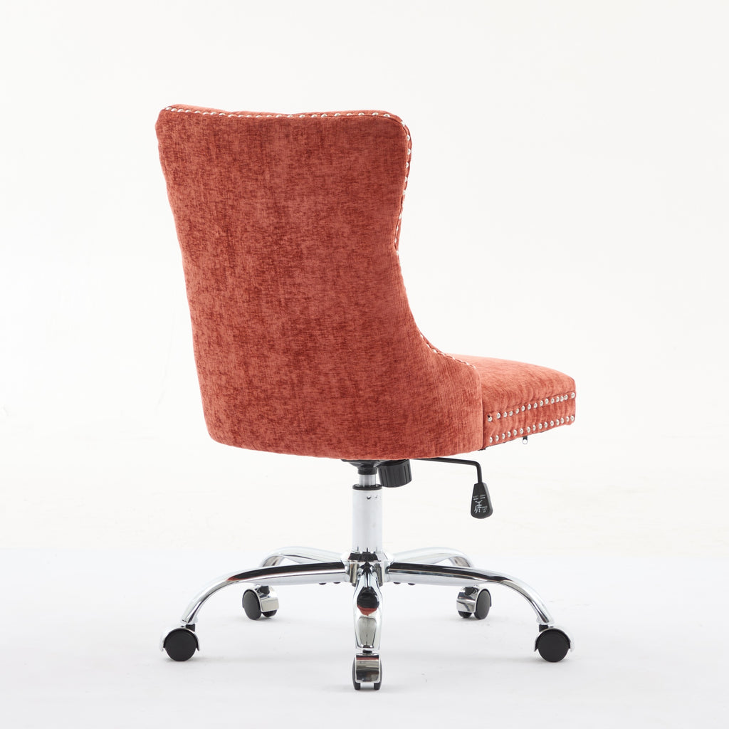 Orange office chair with tufted backrest in a home office setting