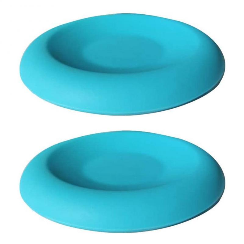 Two turquoise silicone coasters on a white background
