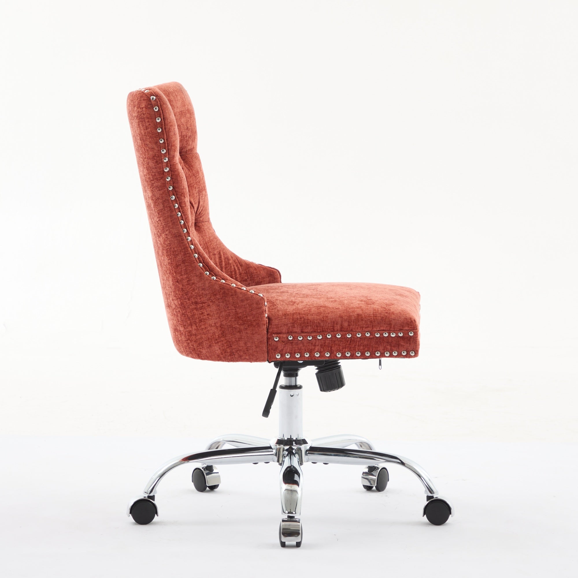 Orange office chair with studded details on a white background