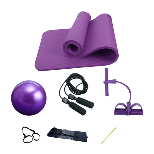 Purple exercise mat, ball, jump rope, resistance bands, and other fitness tools on a white background