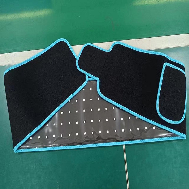 Black car floor mats with blue edges on a green surface