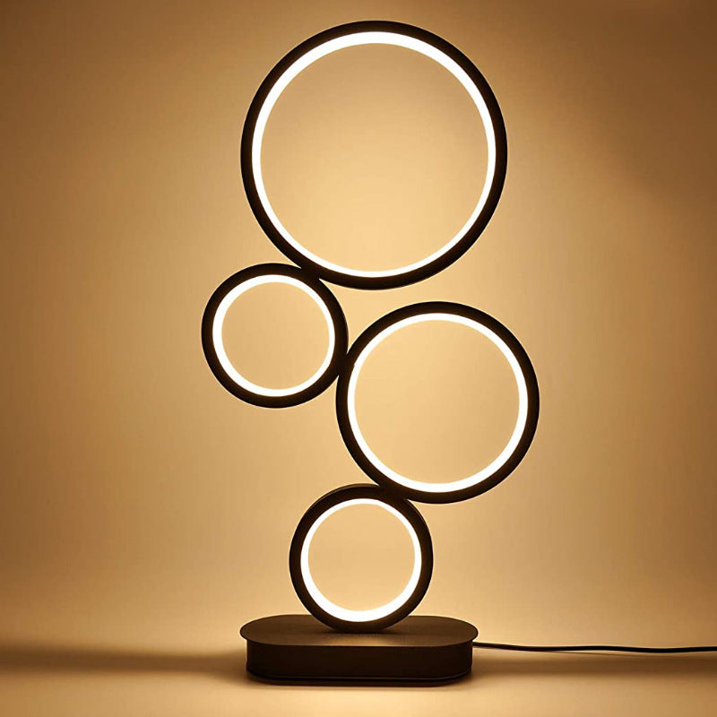 Modern table lamp with circular design on a beige background
