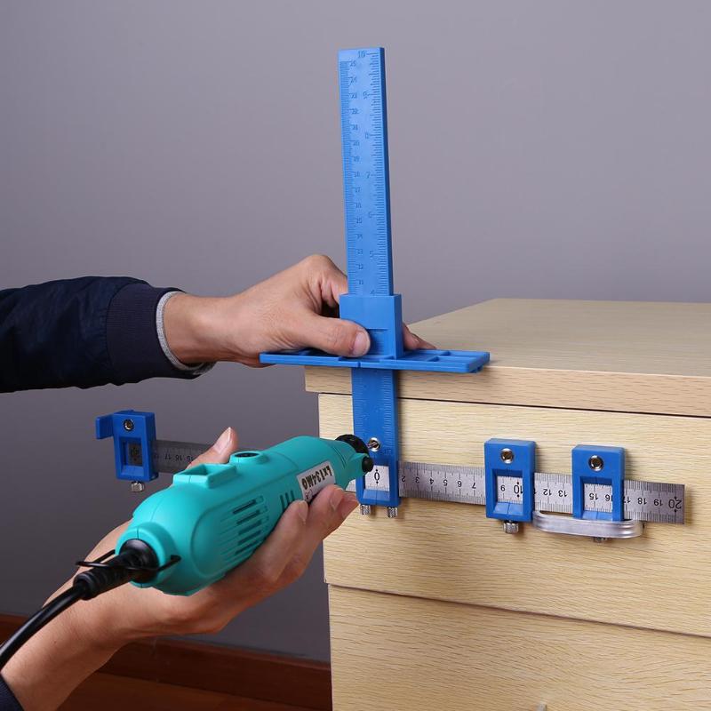 Person using a blue drilling guide on a wooden surface with a gray background