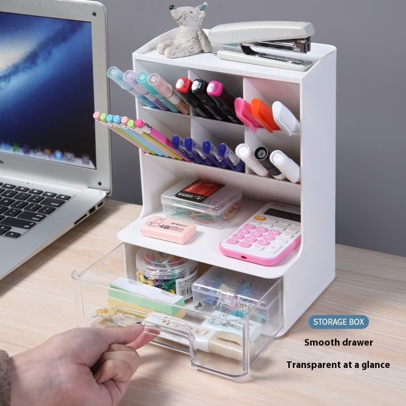 White desk organizer with stationery items on a wooden desk next to a laptop.