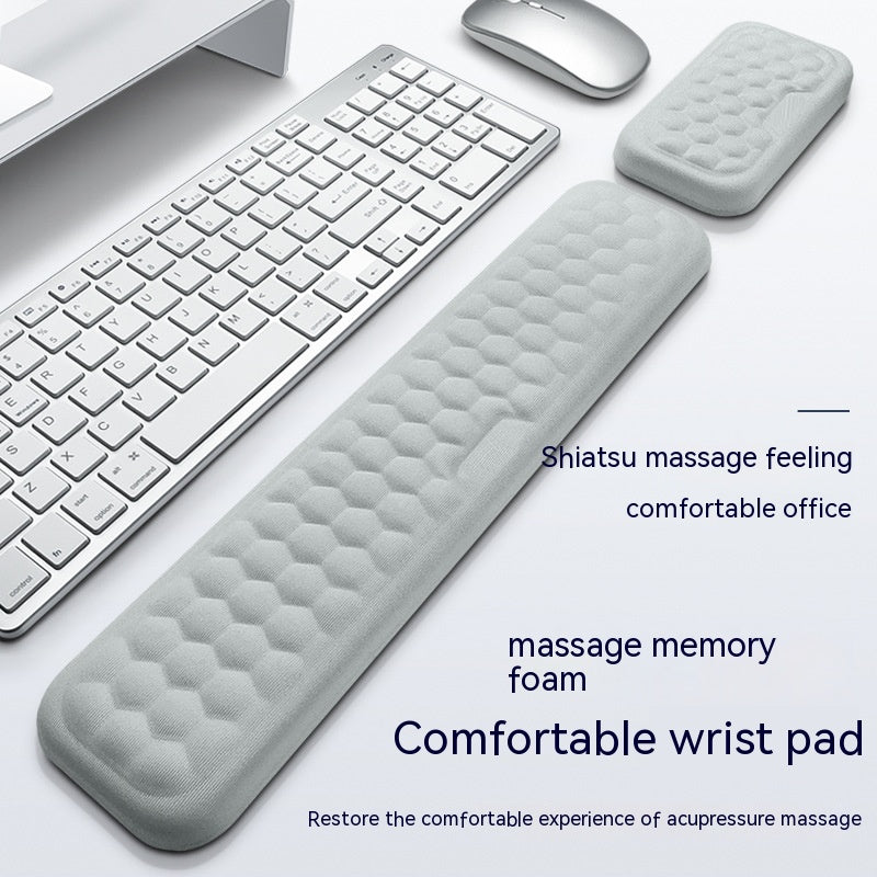 Gray wrist pad with text on a white background