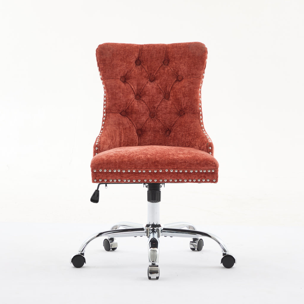 Orange office chair with tufted backrest and chrome base on a white background