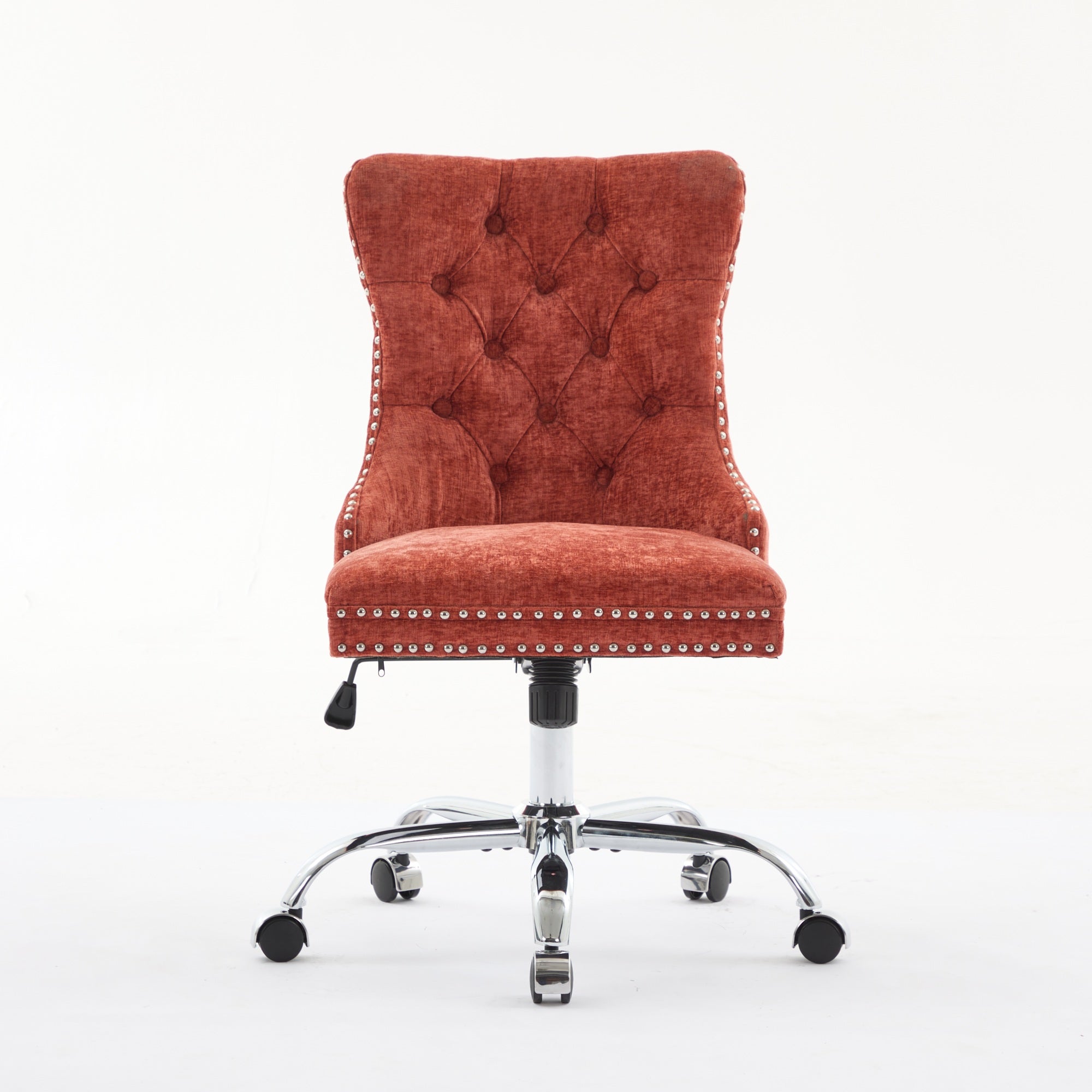 Orange office chair with tufted backrest and chrome base on a white background