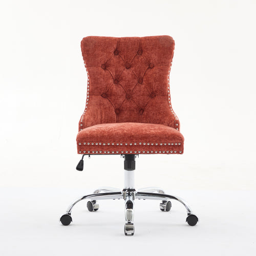 Orange office chair with tufted backrest and chrome base on a white background