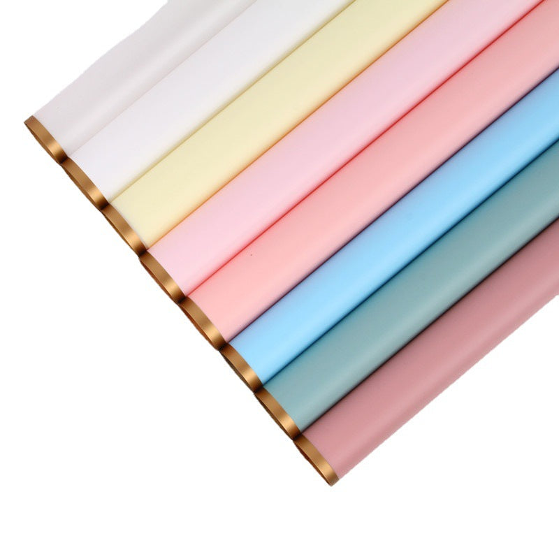Set of pastel-colored fabric swatches arranged in a row on a white background.