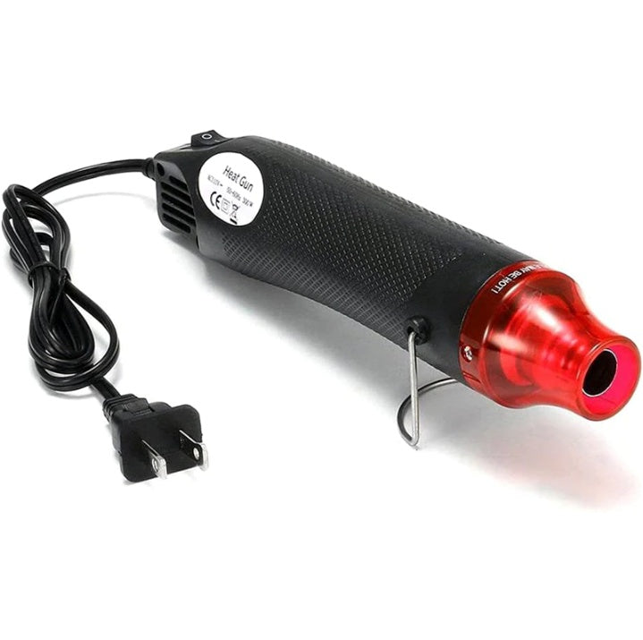 Heat gun with red nozzle and black body on a white background