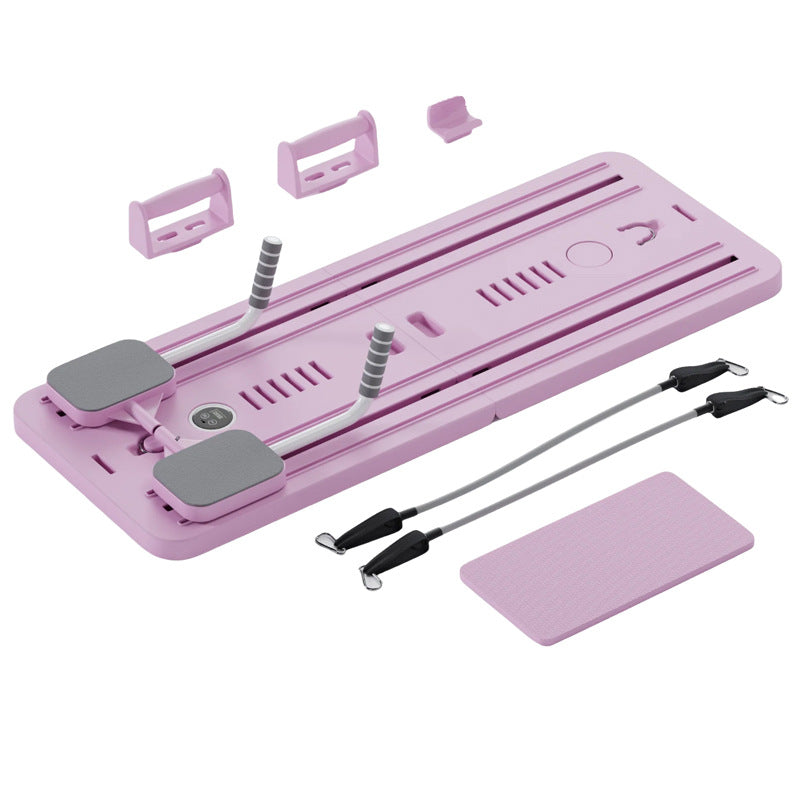 Pink grooming tool set with attachments on a white background