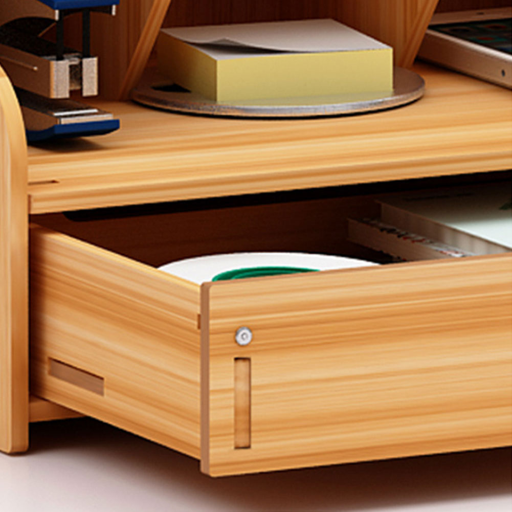Wooden desk with open drawer containing office supplies