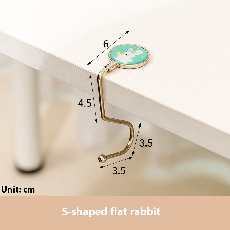 Gold S-shaped flat rabbit hook with measurements on a white background