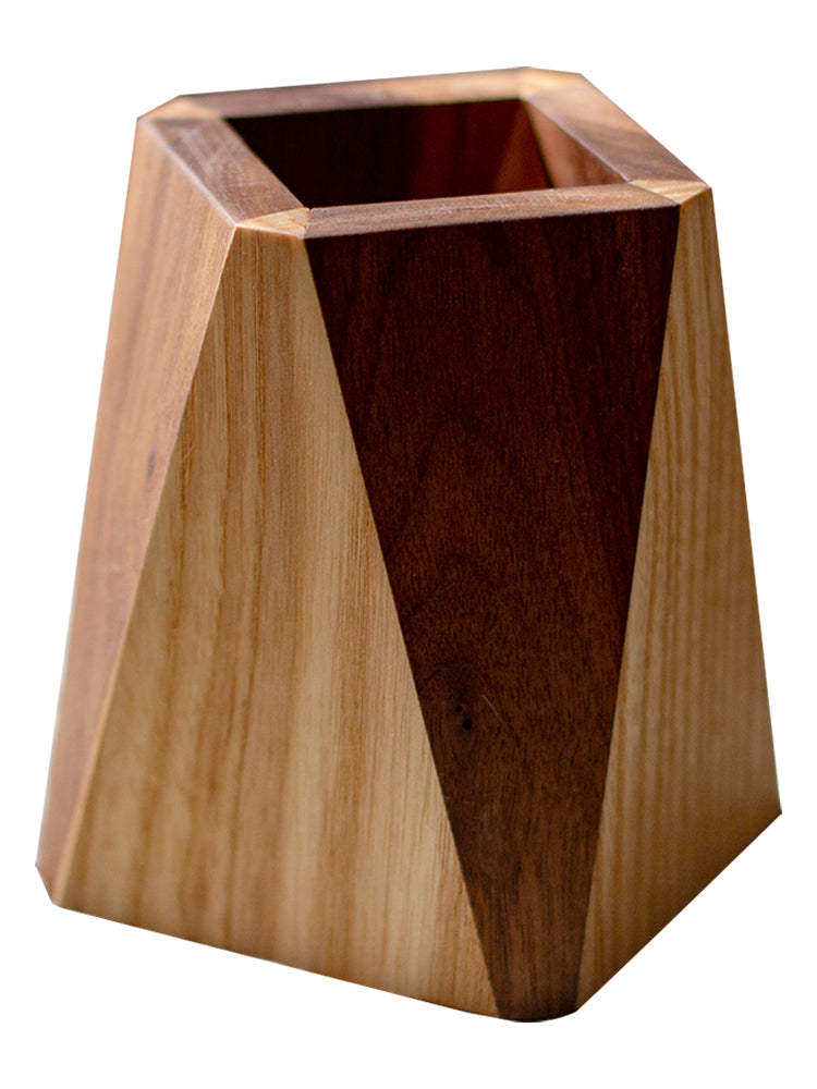 Wooden geometric vase with two-tone finish on a white background