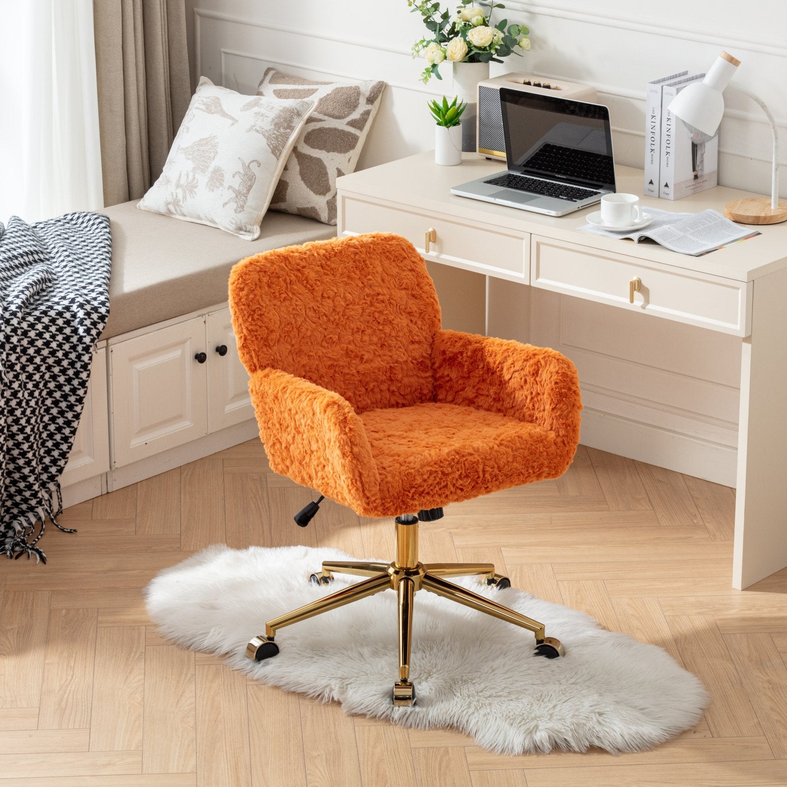 Orange fluffy office chair in a home office setting with a desk and computer.