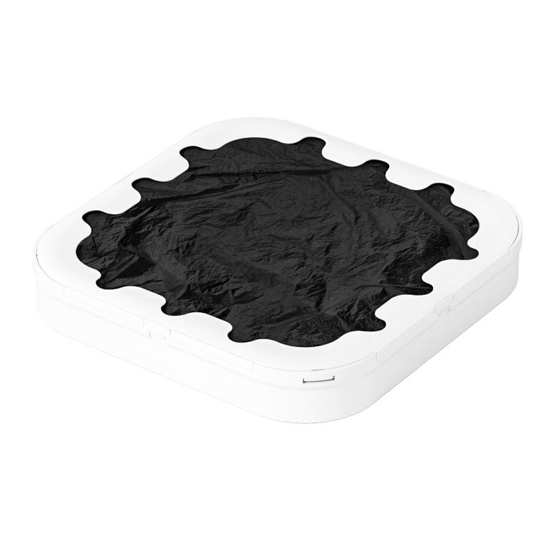 Black hairpiece on a white background