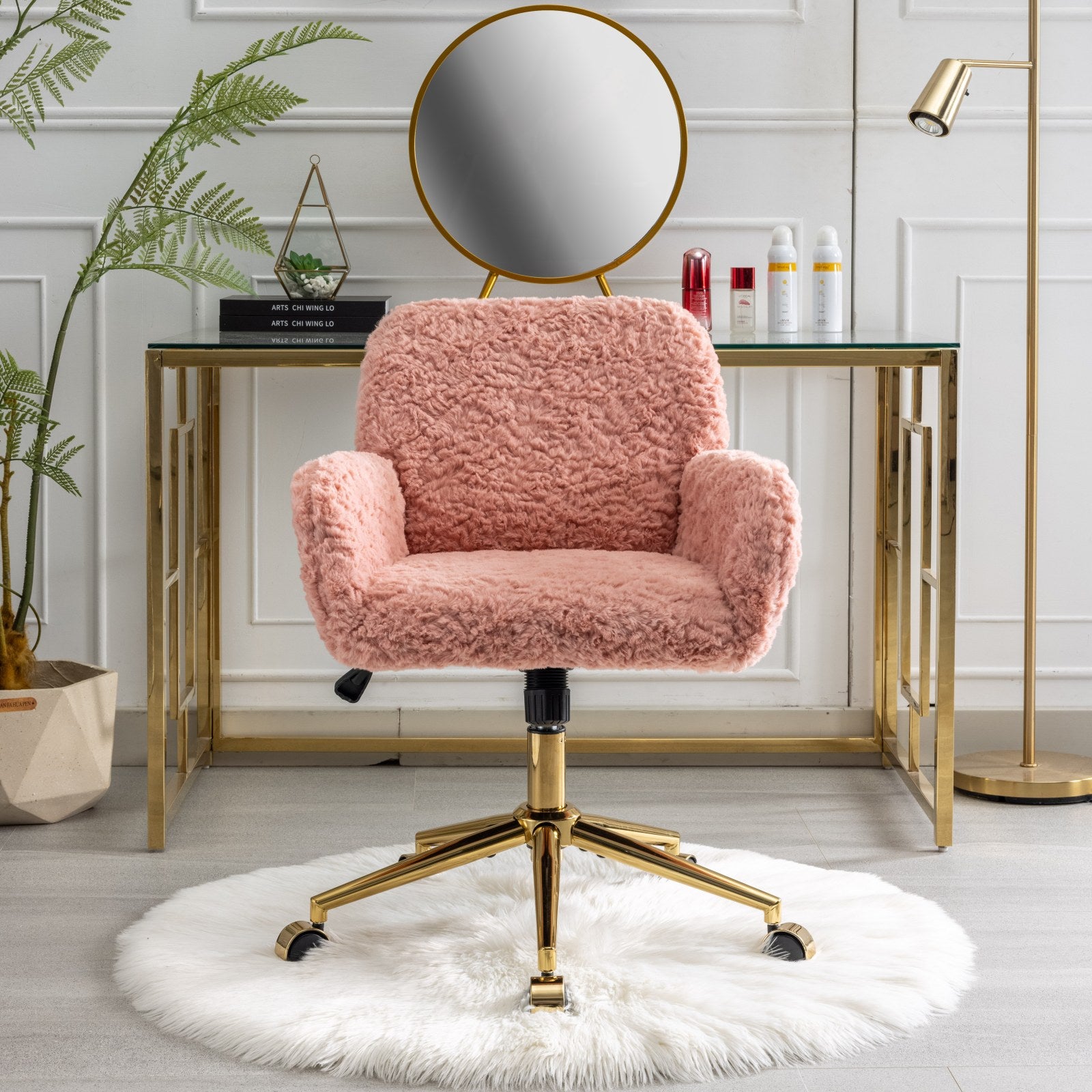 Pink fluffy office chair with gold base on a white background