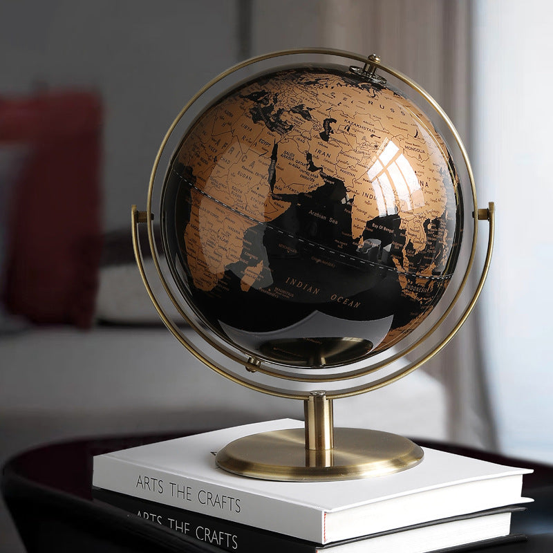 Decorative globe on a stack of books with a blurred background
