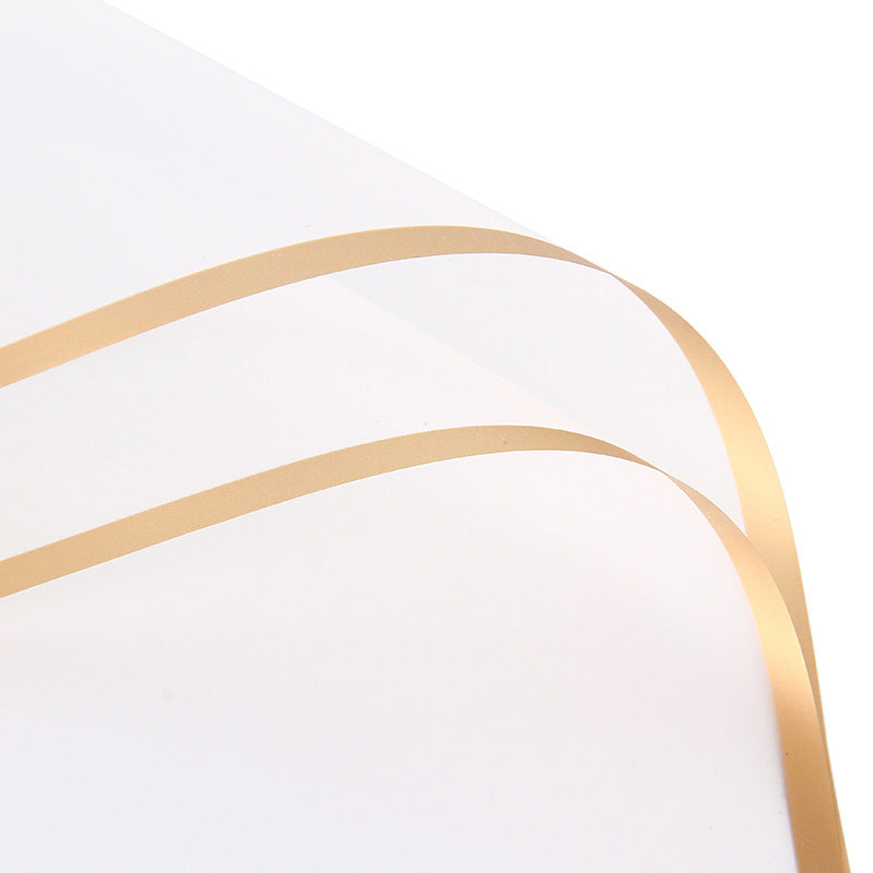 Close-up of a white surface with a gold decorative element on a white background