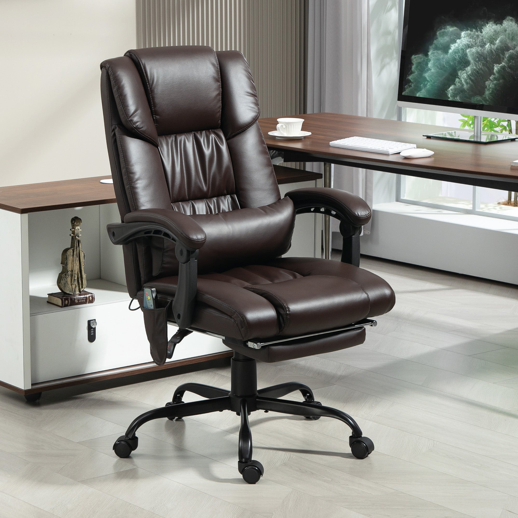 Brown leather office chair in an office setting with a desk and computer monitor.
