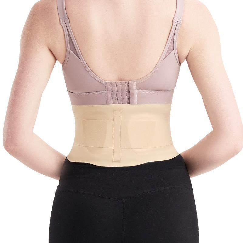 Person wearing a beige waist trainer with a white background