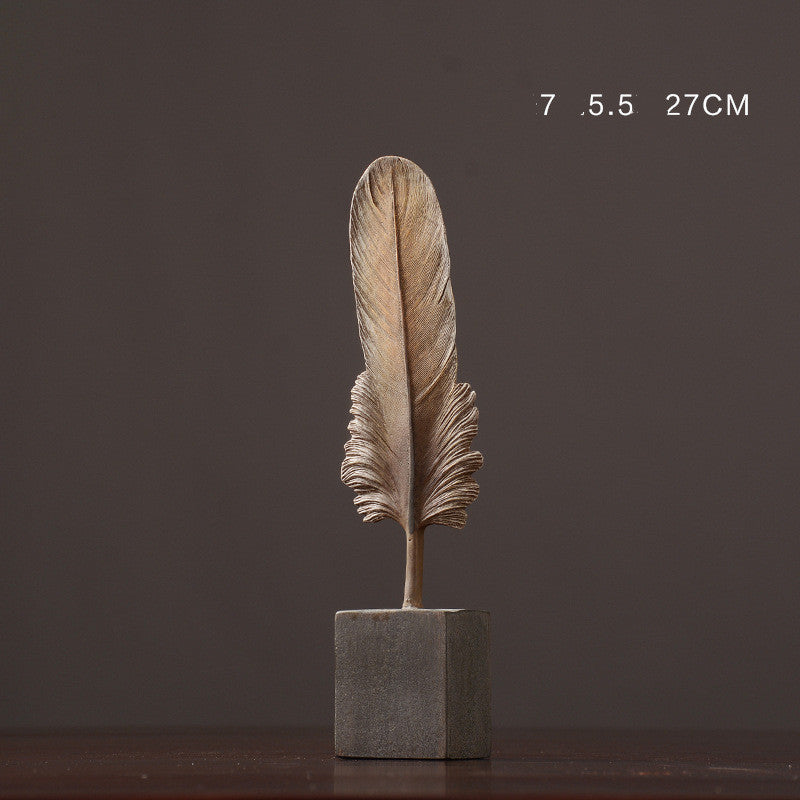 Decorative feather sculpture on a dark background
