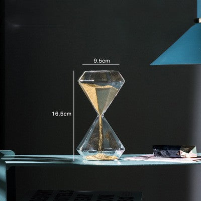 Glass hourglass with measurements on a dark background