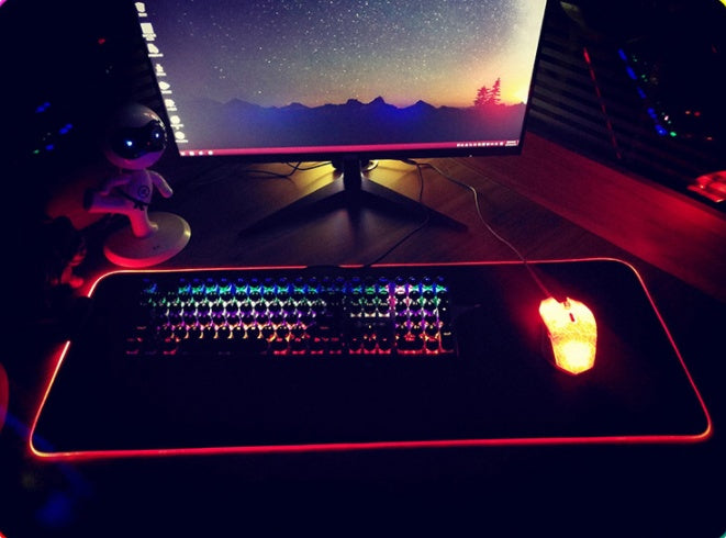 Gaming setup with keyboard, mouse, and monitor on a desk