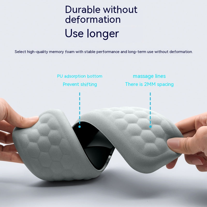 Gray massage pillow with text highlighting durability and features on a white background