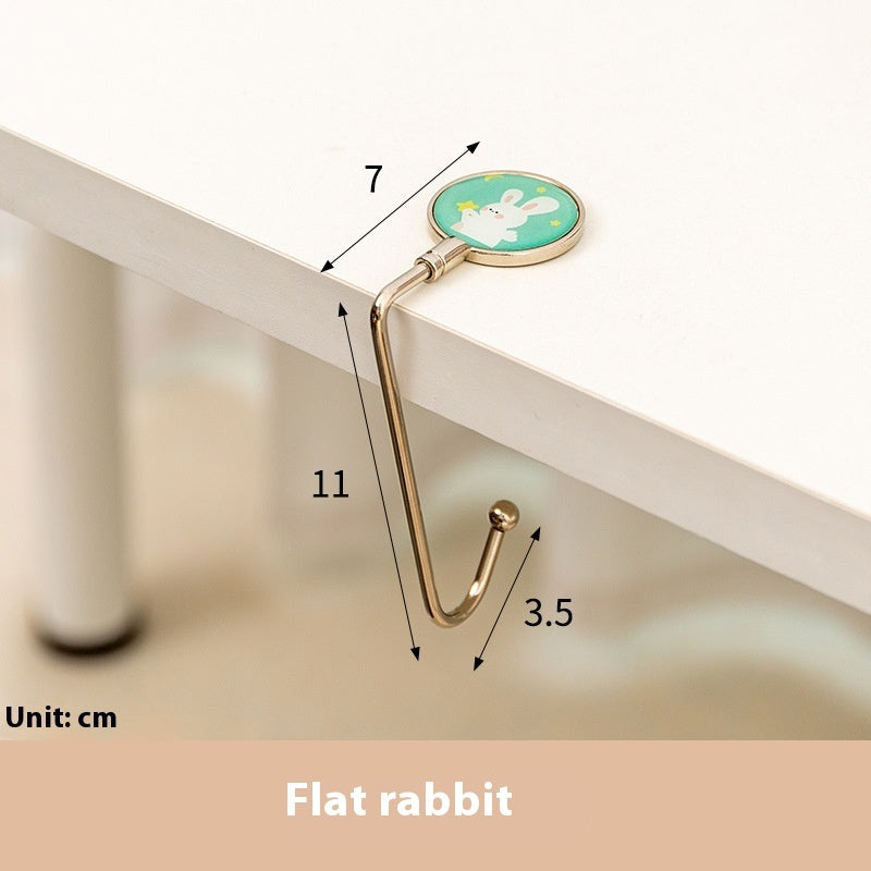 Hook with cartoon design on a white surface, showing measurements in centimeters.