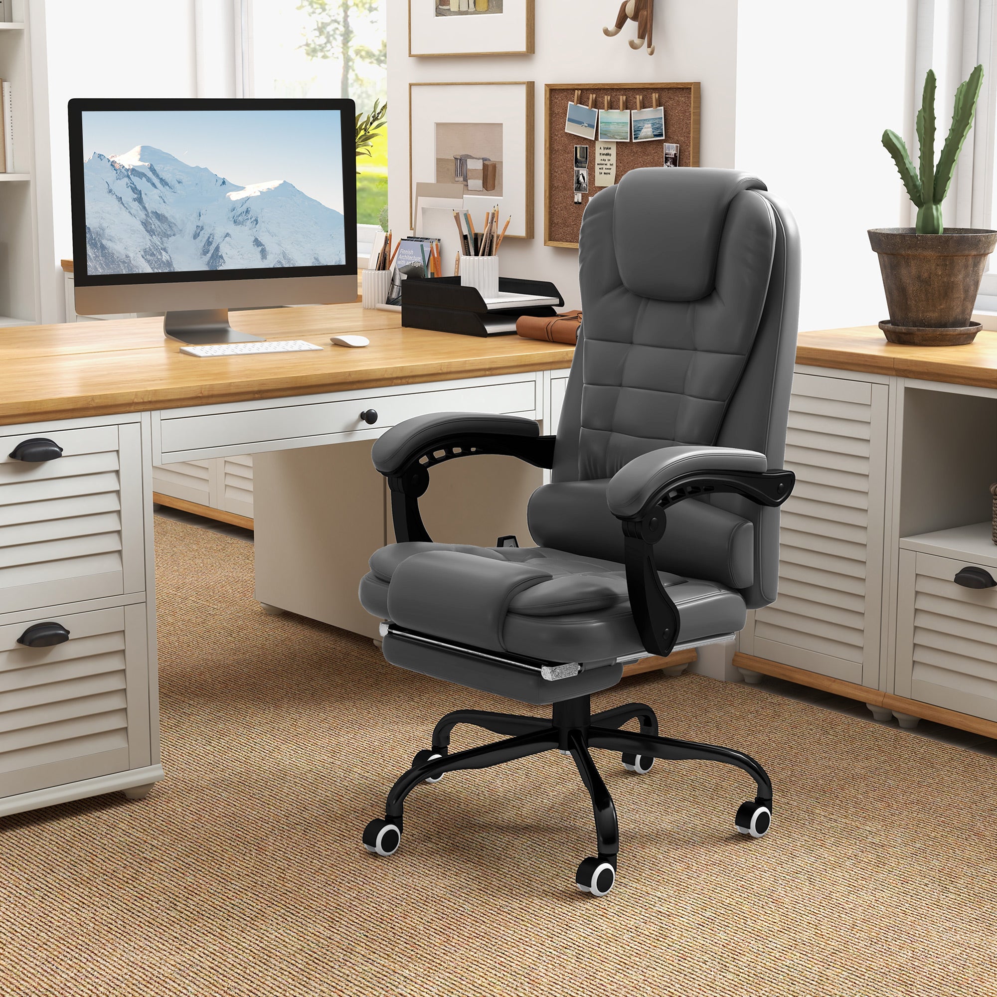 Gray office chair in a home office setting with a desk and computer monitor.