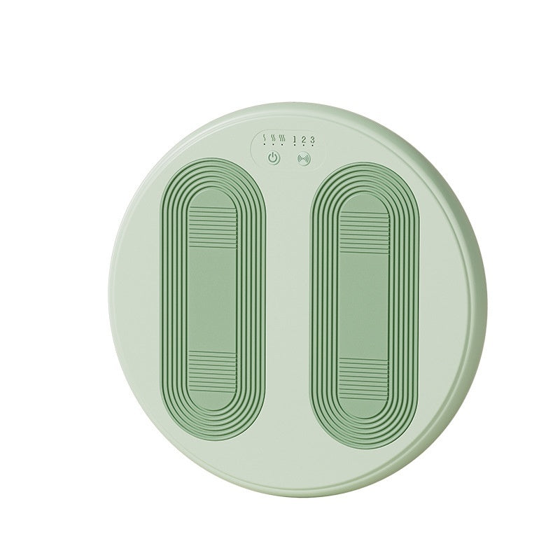 Round green device with two footprints and control buttons on a white background