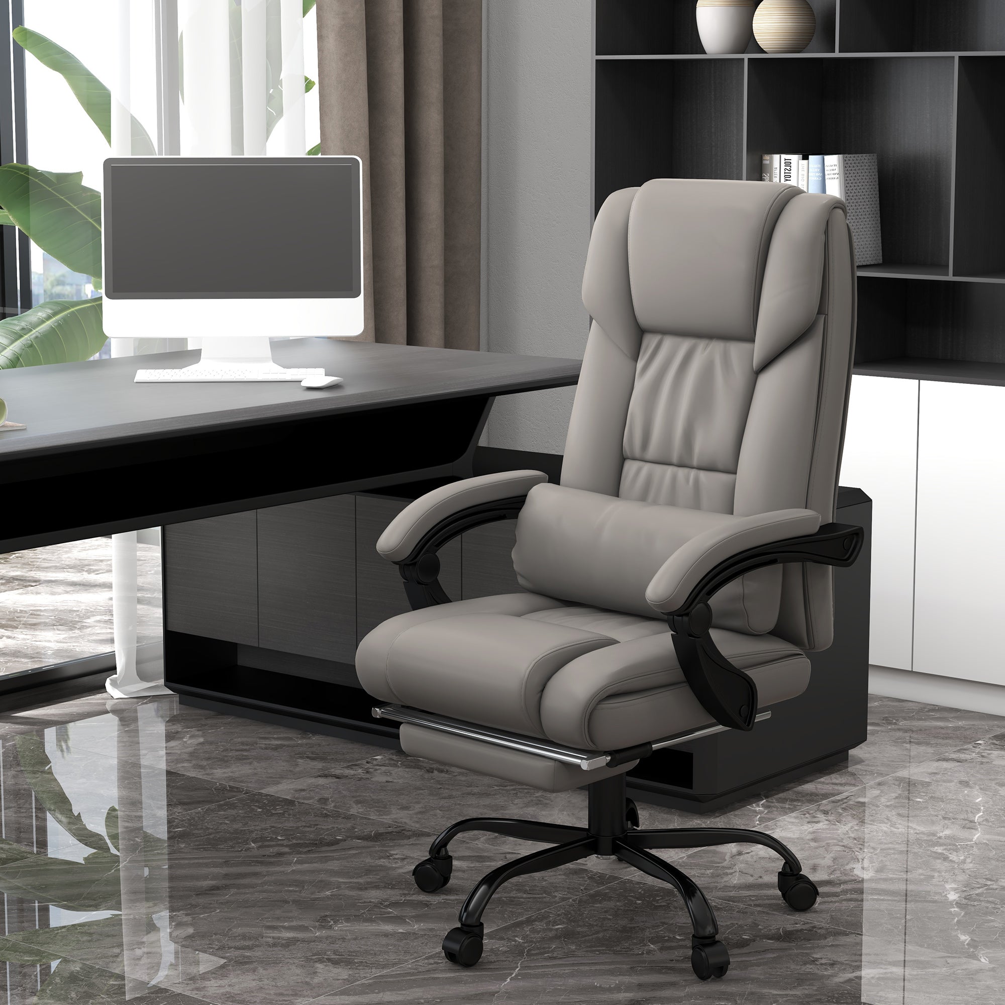 Gray office chair in a modern office setting with a desk and computer.