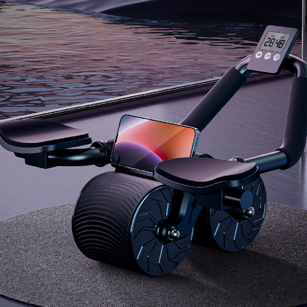 Black exercise device with smartphone holder and digital display on a dark surface.