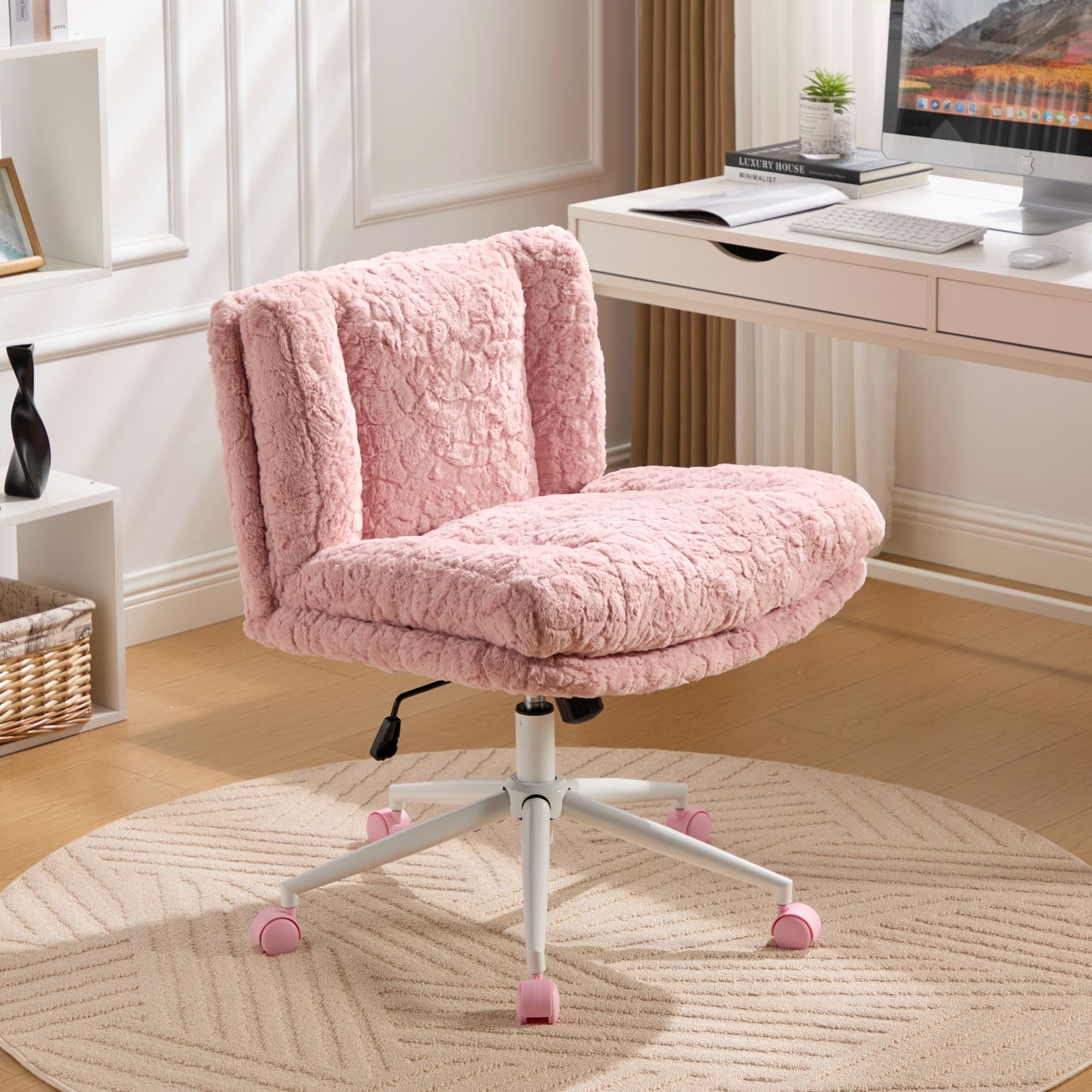 Pink plush office chair in a home office setting with a desk and computer.