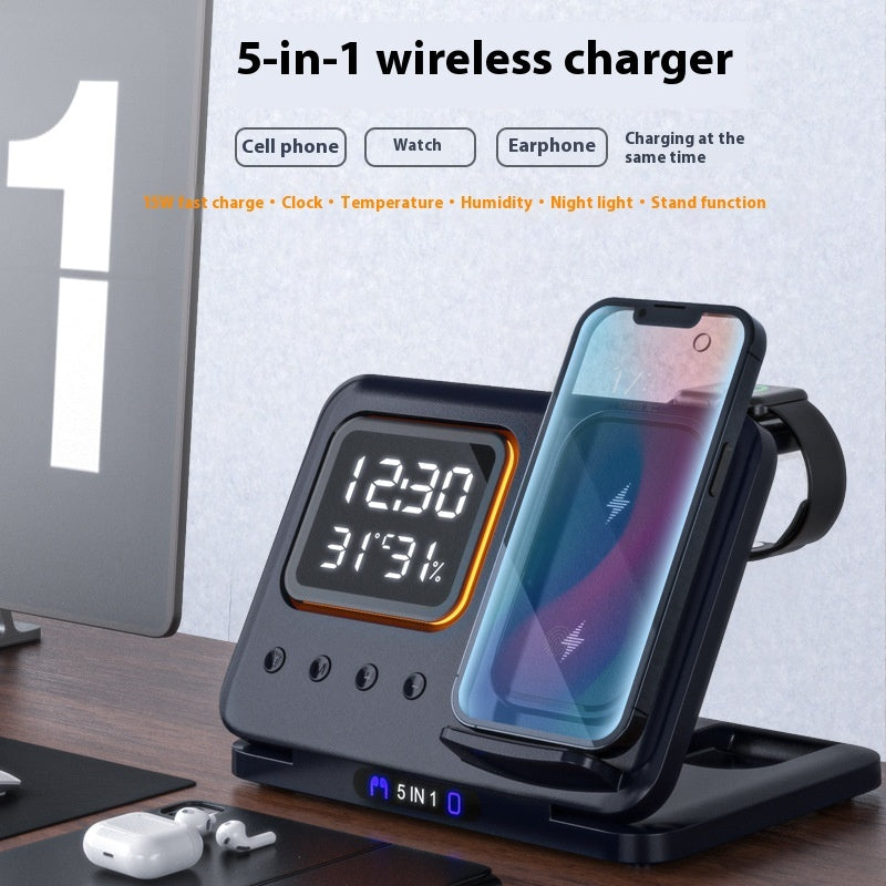 5-in-1 wireless charger with phone, watch, and earbuds on a desk.