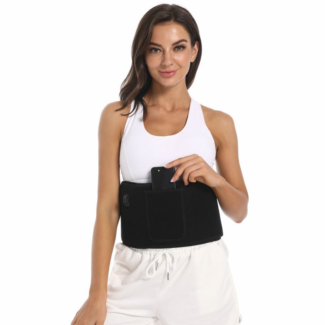 Woman wearing a black waist support belt holding a phone on a white background