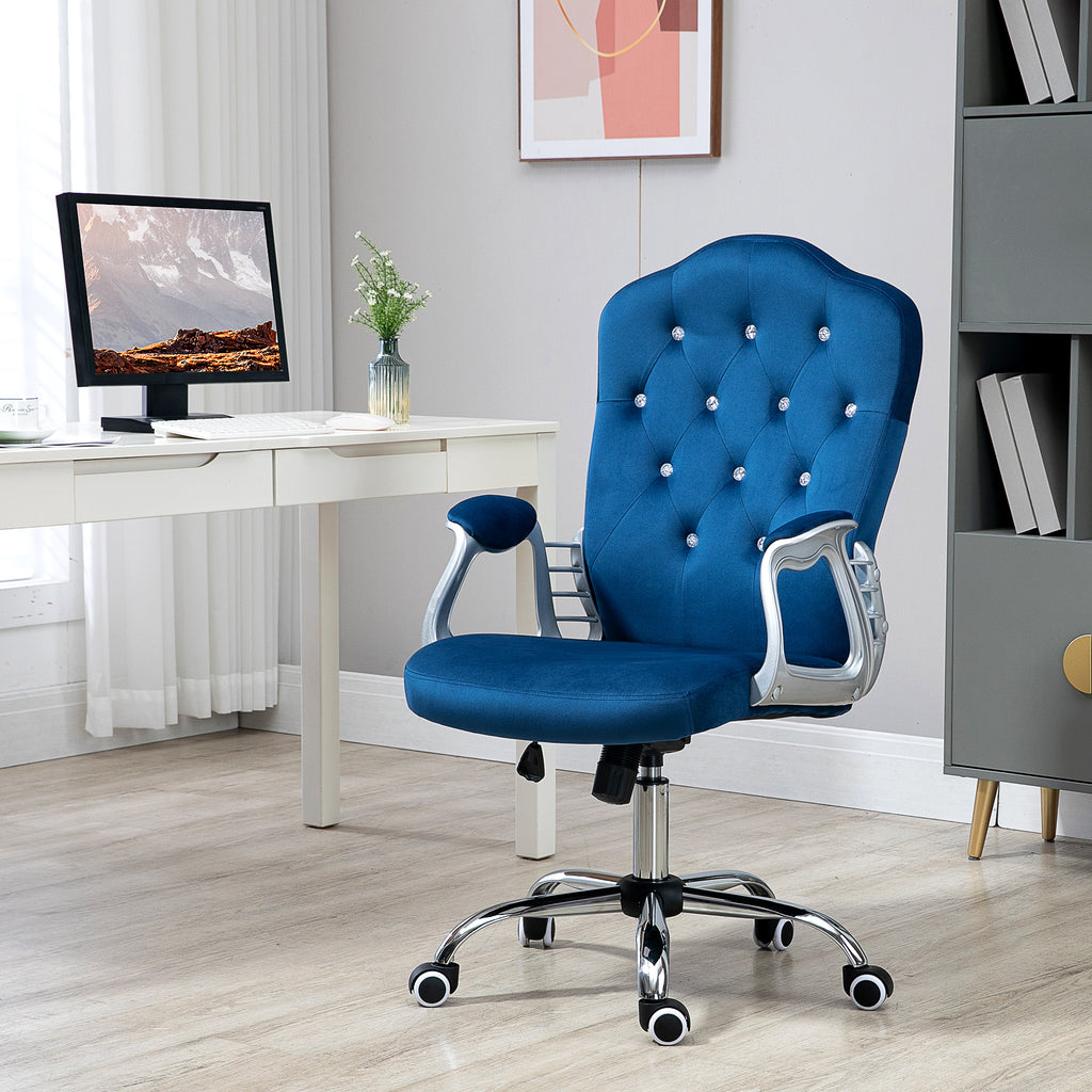 Blue office chair in a modern office setting with a desk and decor.