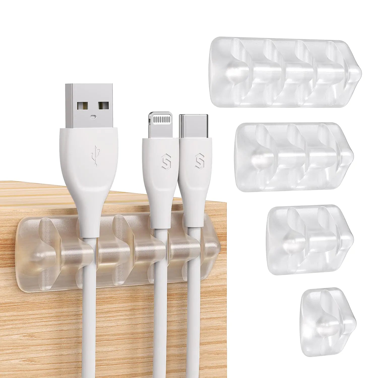 Set of cable clips holding USB cables on a wooden surface with clear cable organizers.